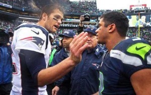 Patriots QB Tom Brady and Seahawks QB Russell Wilson talk during an earlier game, prior to the Sunday, Feb. 1, 2015 Super Bowl.